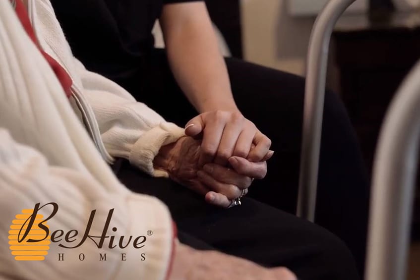 Elderly Senior Holding hands with Caregiver in Texas